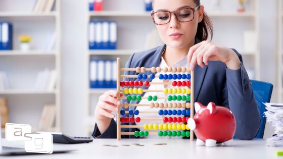 A woman in an office setting focuses intently on an abacus, symbolizing the importance of understanding and leveraging sales data.